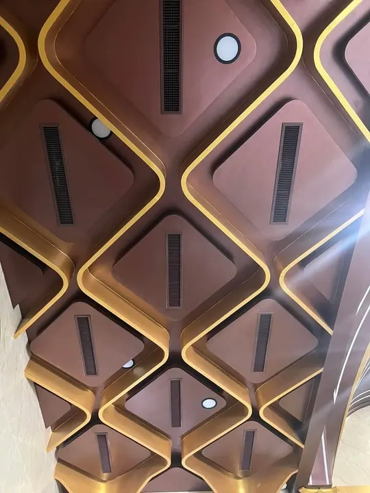 Slot diffusers in a decorative geometric ceiling